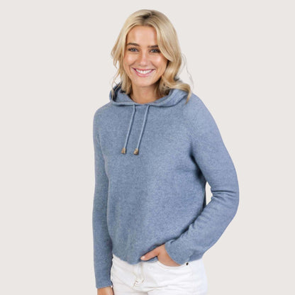 Model wearing a Crystal blue cropped knitted hoodie with drawstring hood