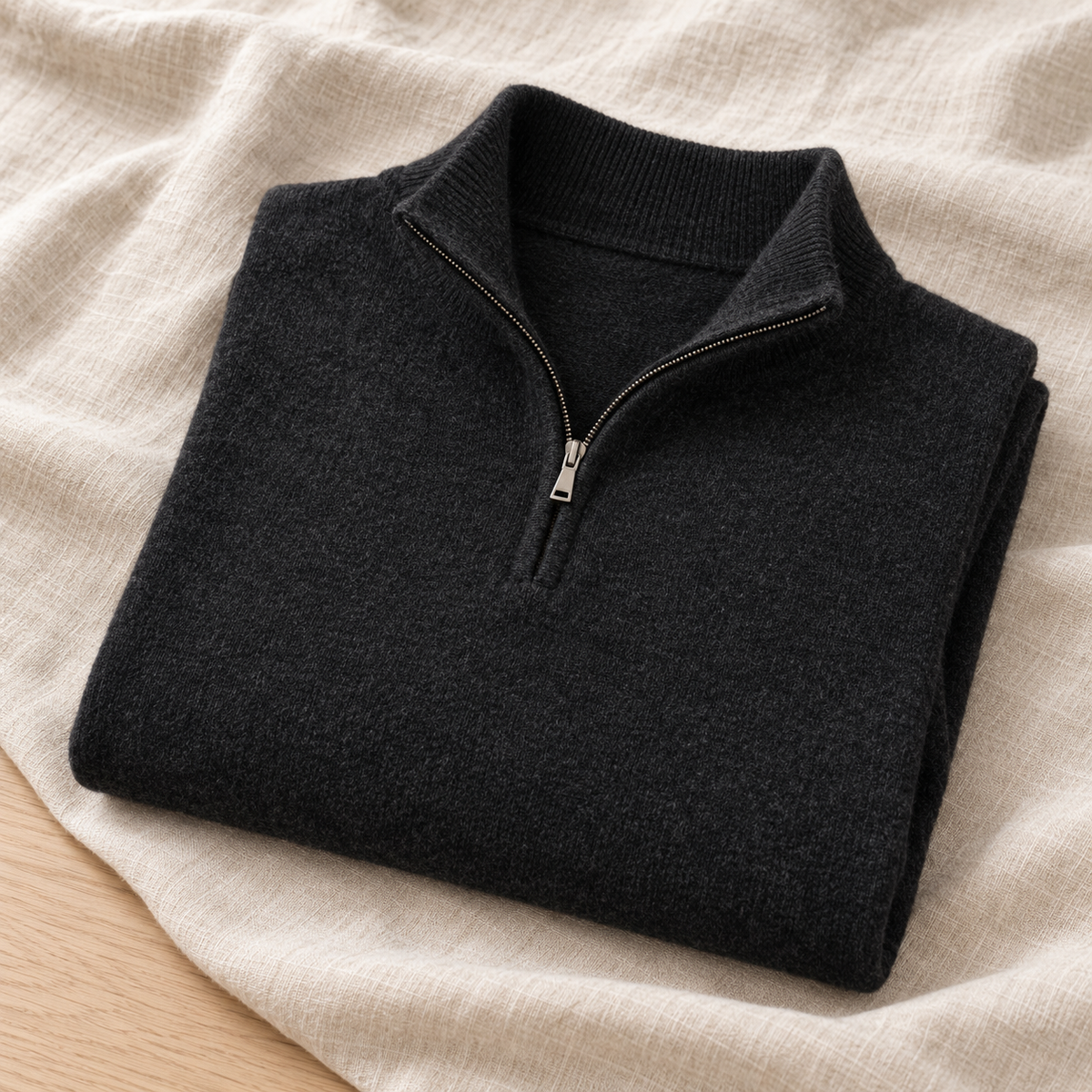 AI-generated lifestyle flatlay of NB435 in Charcoal, folded on linen
