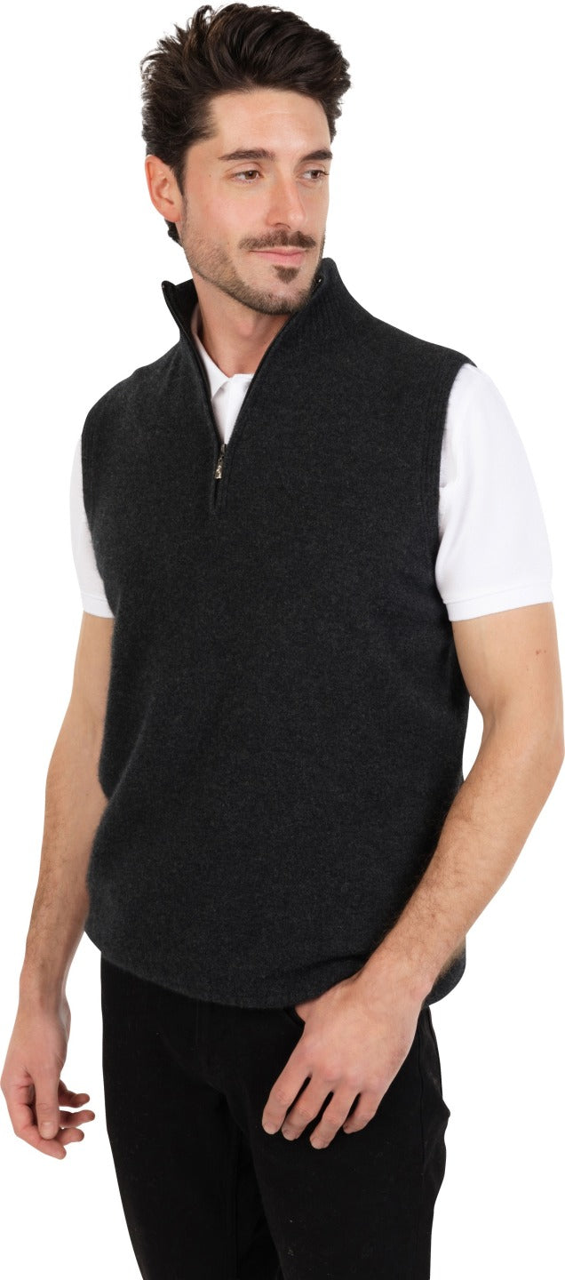 Model wearing a Charcoal men's sleeveless half-zip knitted vest over a white polo shirt