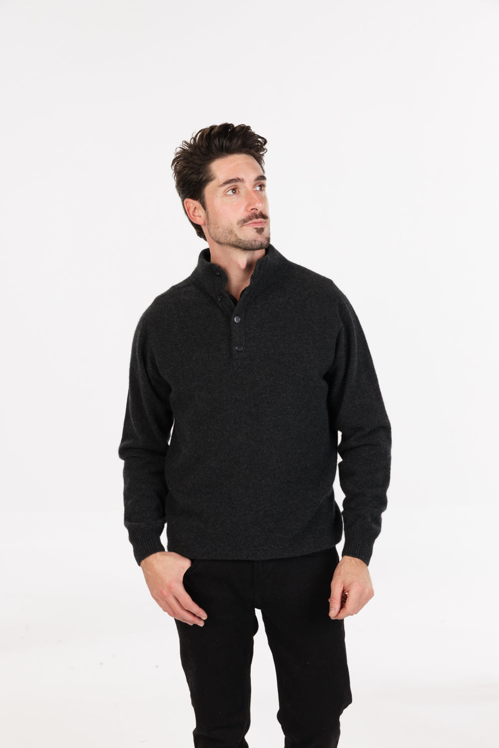 Model wearing men's possum merino & silk button collar jumper in Charcoal
