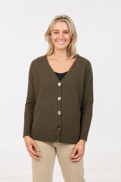 Model wearing women's possum merino & silk relaxed cardigan in Fern