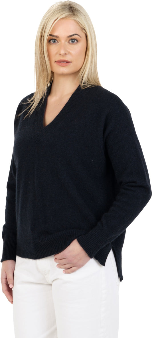 Model wearing a dark navy relaxed V-neck jumper